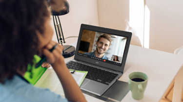 Young African-American female doctor working online with her patients