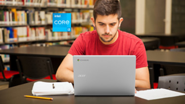 Handsome young college student using a laptop for school work in the library; Shutterstock ID 275972744; purchase_order: -; job: -; client: -; other: -