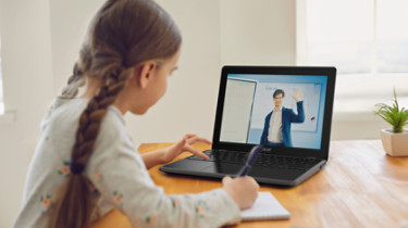Online education of children. Girl schoolgirl teaches a lesson online using a laptop video chat call conference with a teacher at home.; Shutterstock ID 1723955134; purchase_order: -; job: -; client: -; other: -