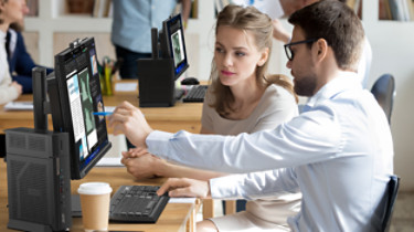 Executive manager mentor teaching intern employee giving instructions showing new online project pointing on computer screen, serious worker helping explain colleague listen work task look at monitor; Shutterstock ID 1276205116; purchase_order: -; job: -; client: -; other: -